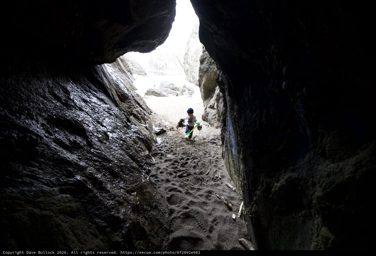 Young Explorer Ventures Into Rocky Coastal Cave