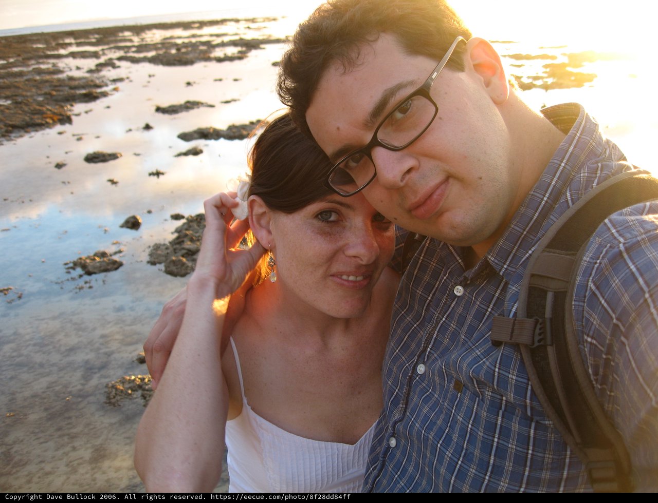 Couple Embracing at Golden Hour Beach Sunset