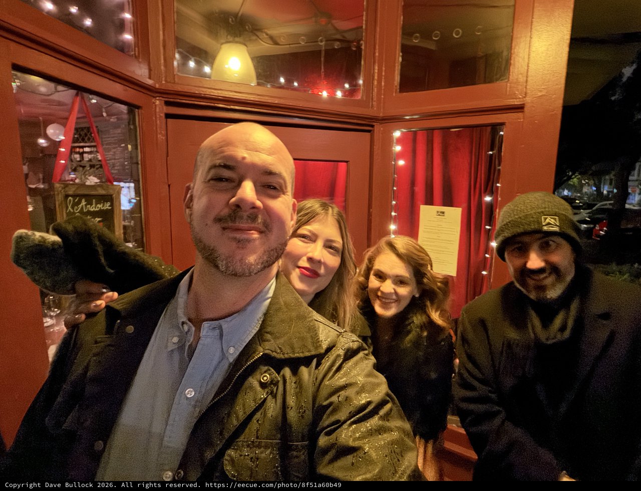 Group Selfie at Cozy Restaurant Entrance
