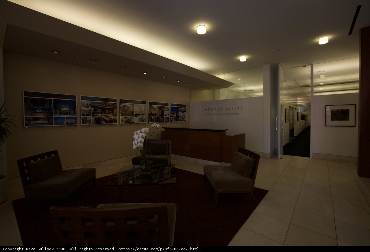 A Cozy Lobby with Wooden Flooring and Art Deco Furniture
