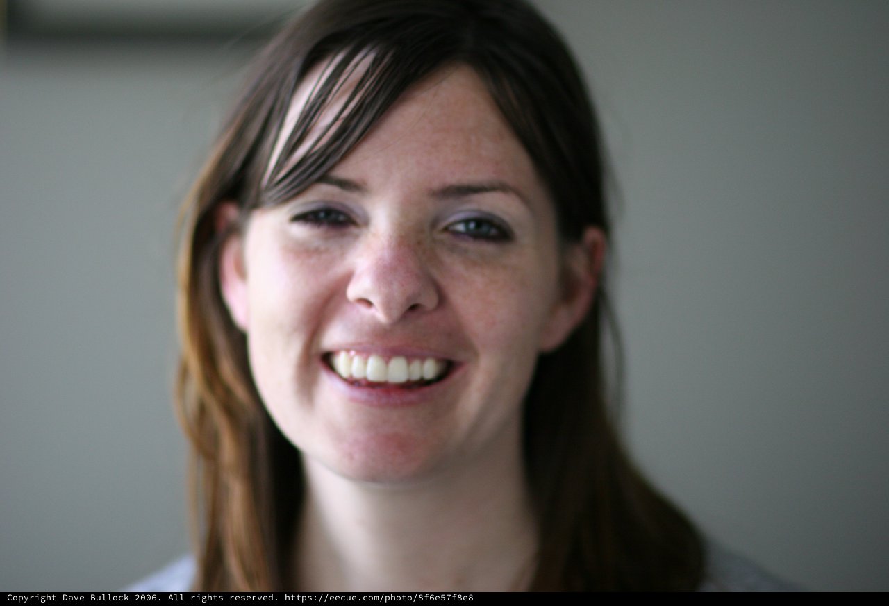 Candid Portrait of a Smiling Young Woman Indoors