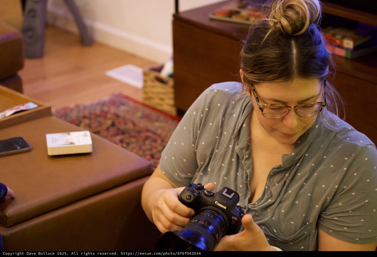 Photographer Reviewing Camera at Home Studio Session