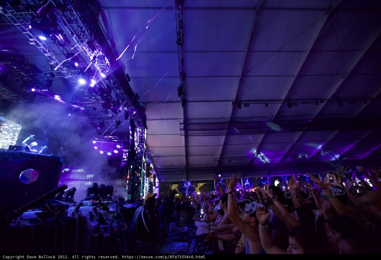 Purple Spotlight on Concert Crowd