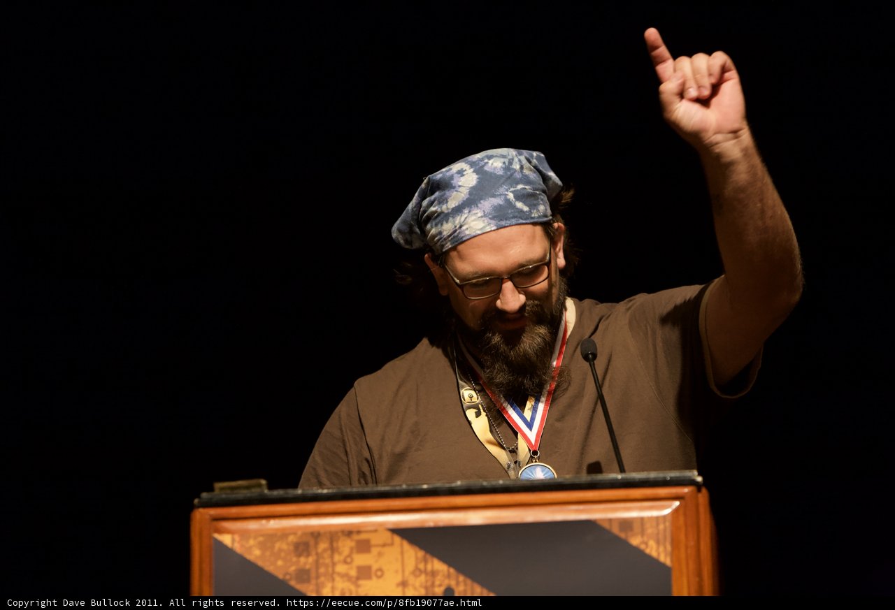 Medal-Wearing Bearded Man Giving Speech