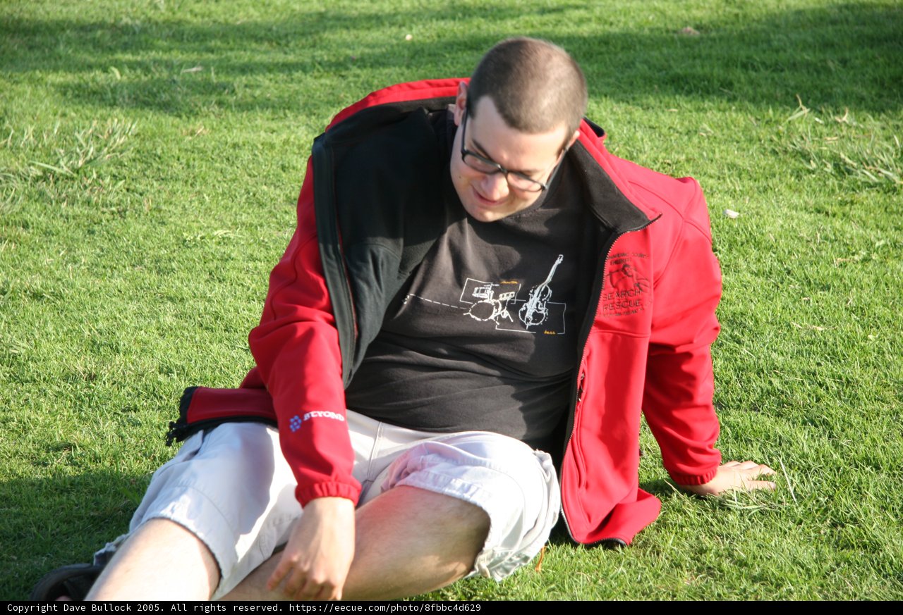 Man sitting on a grassy field