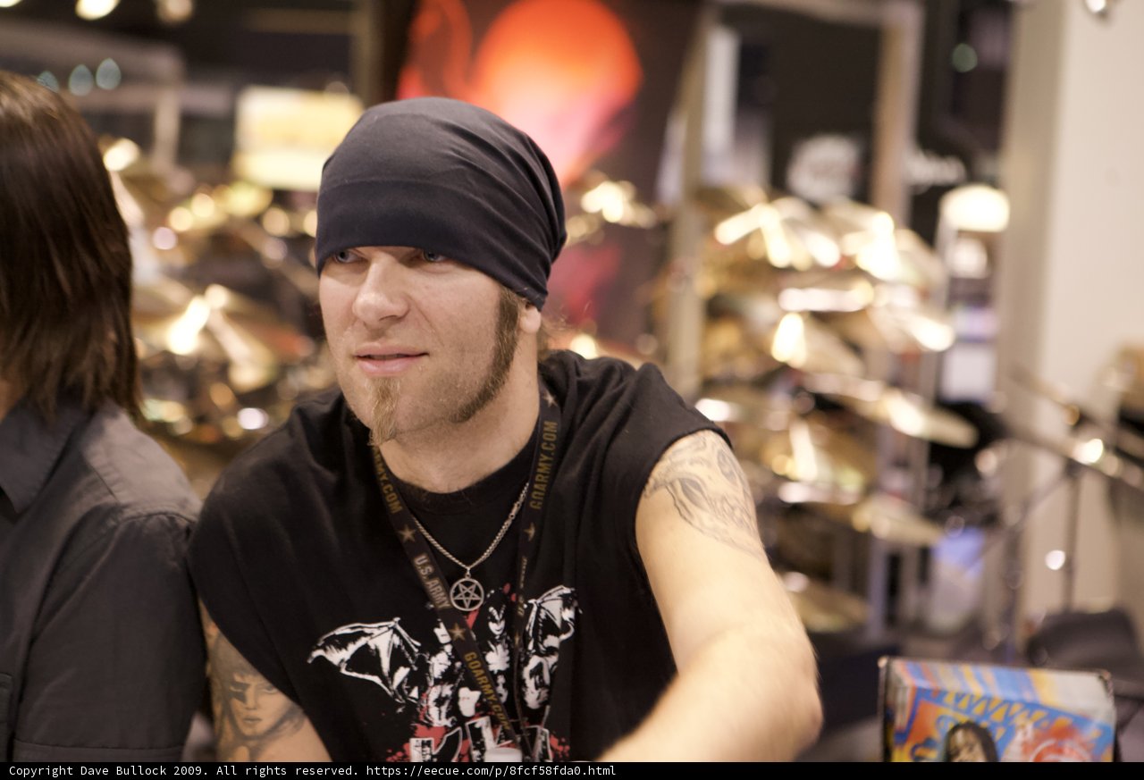 The Tattooed Man in the Black Shirt