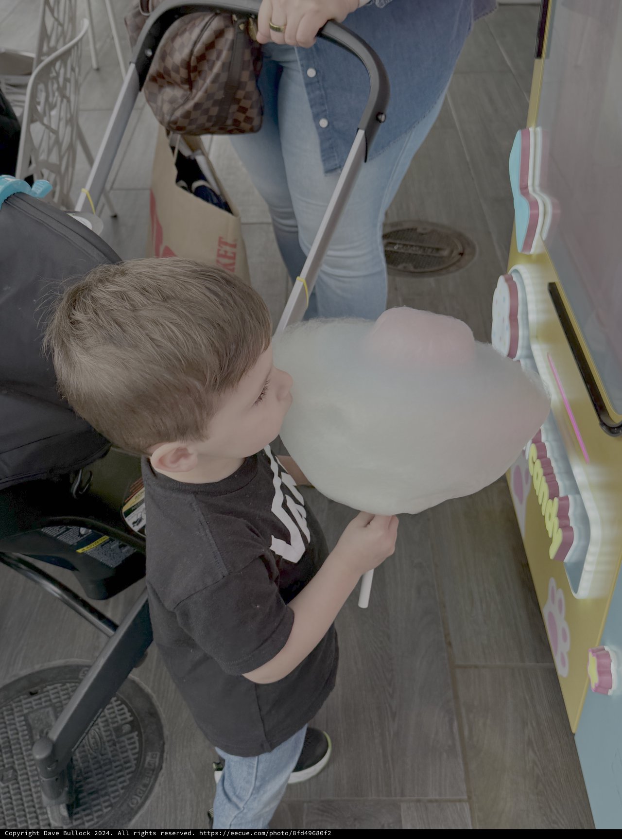 Child Enjoys Cotton Candy at Fair