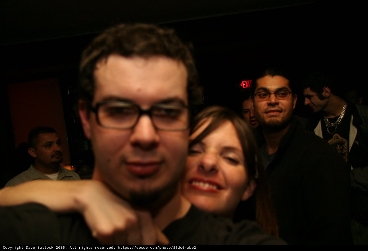 Friends Crowd a Dimly Lit Nightclub in 2005