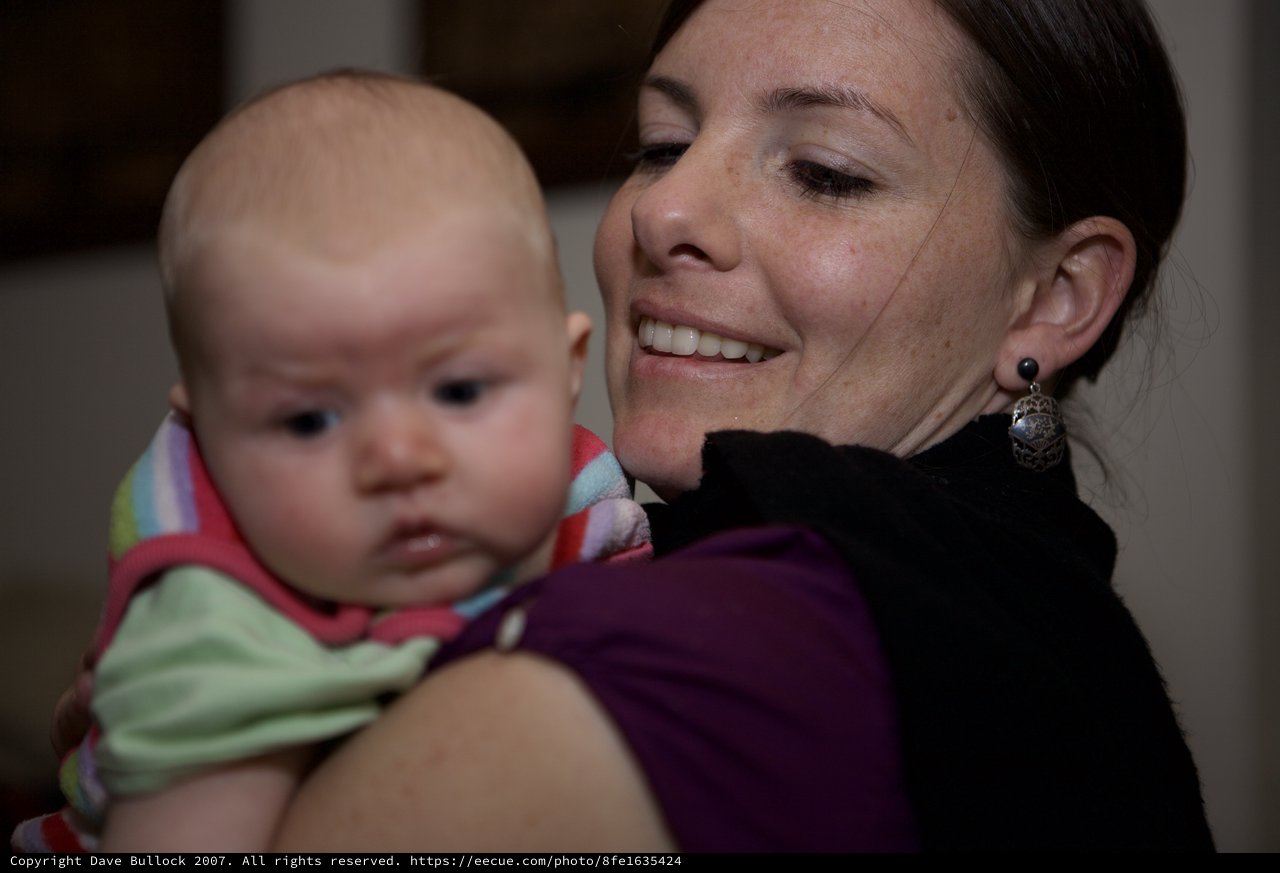 Mother's Joy: Tender Moment with Infant Daughter
