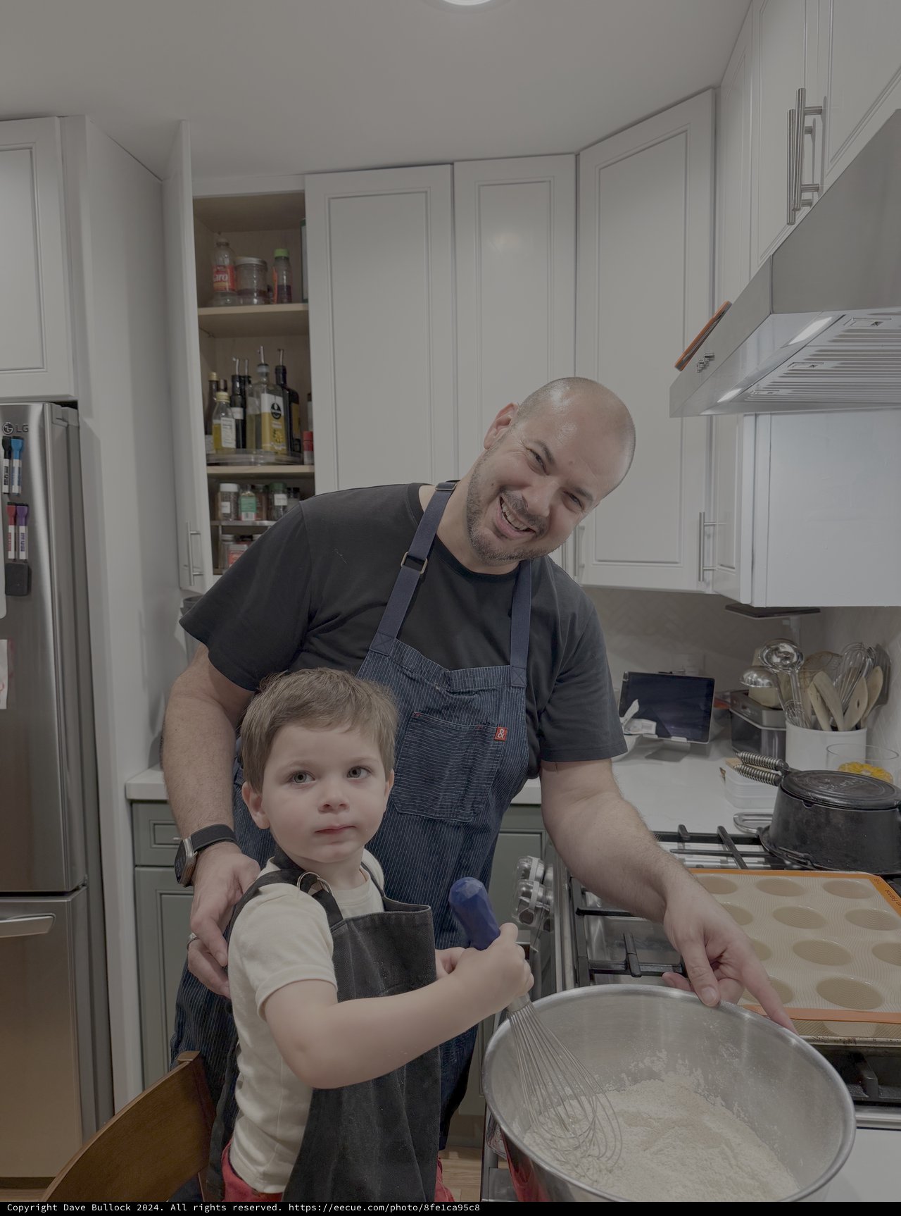 Father and Son Cooking Together in Kitchen