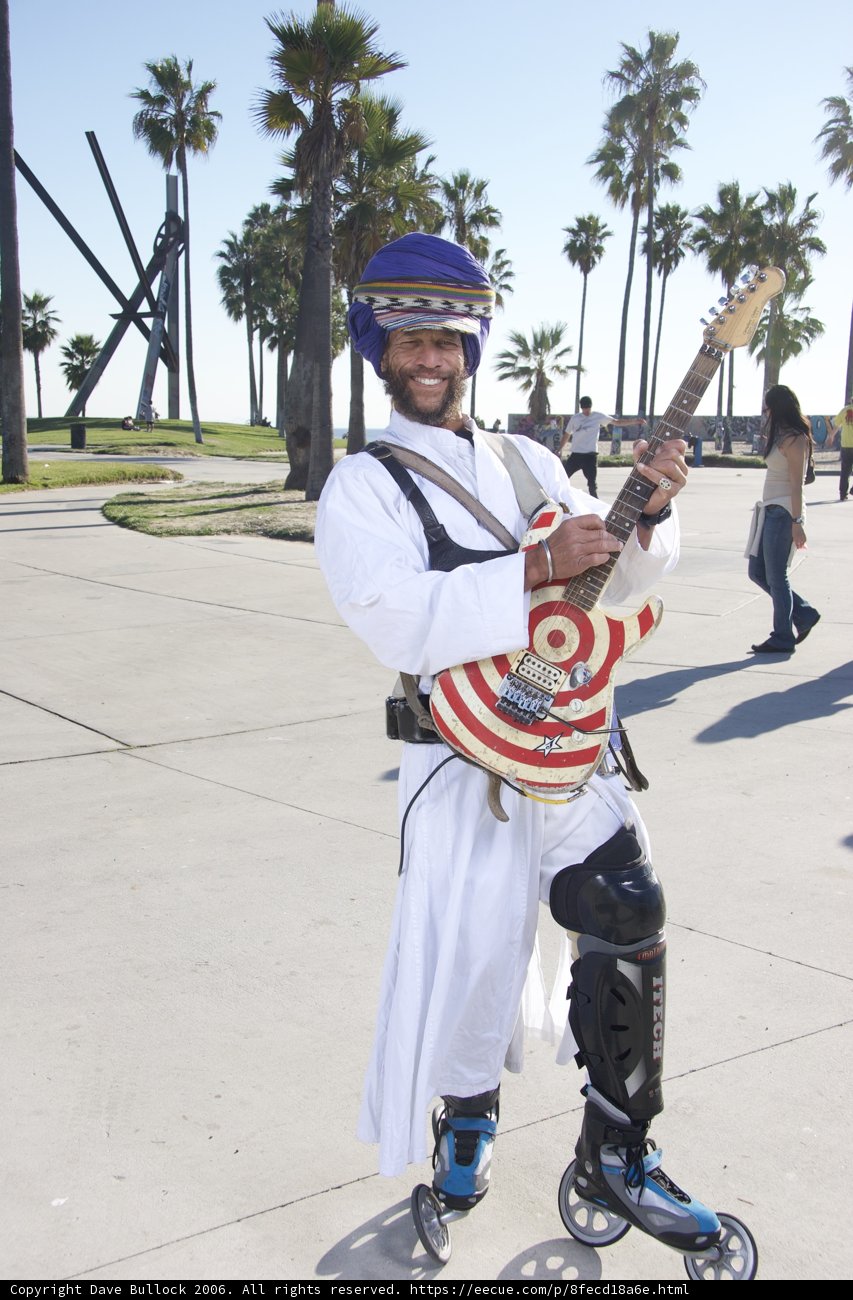 Helmeted Guitarist Rocking Out Under Sunny Skies