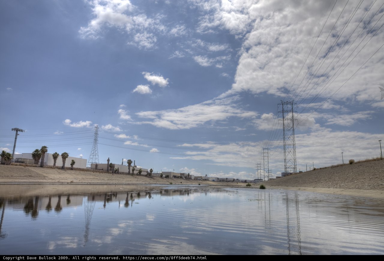 Towering Power Lines Across the River