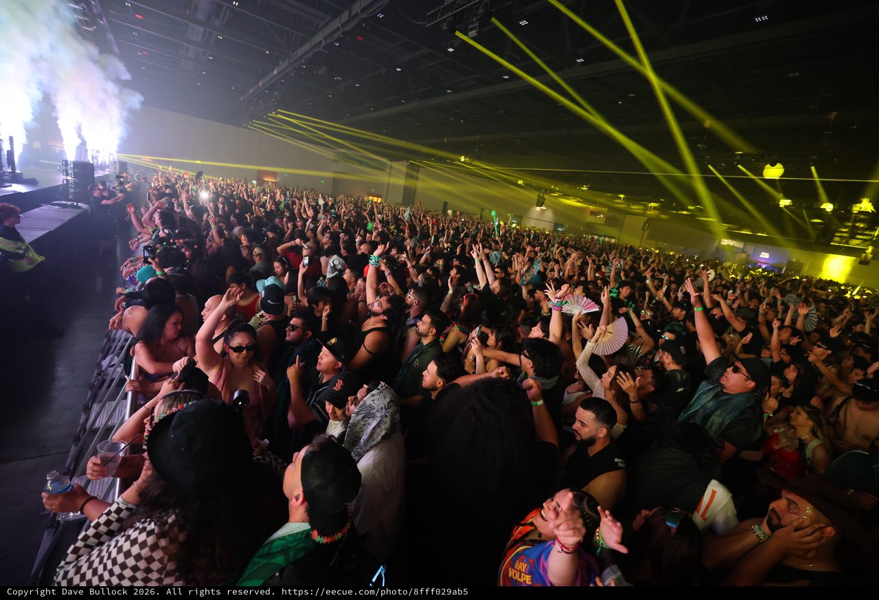 Massive Indoor EDM Festival Crowd Under Laser Light Show
