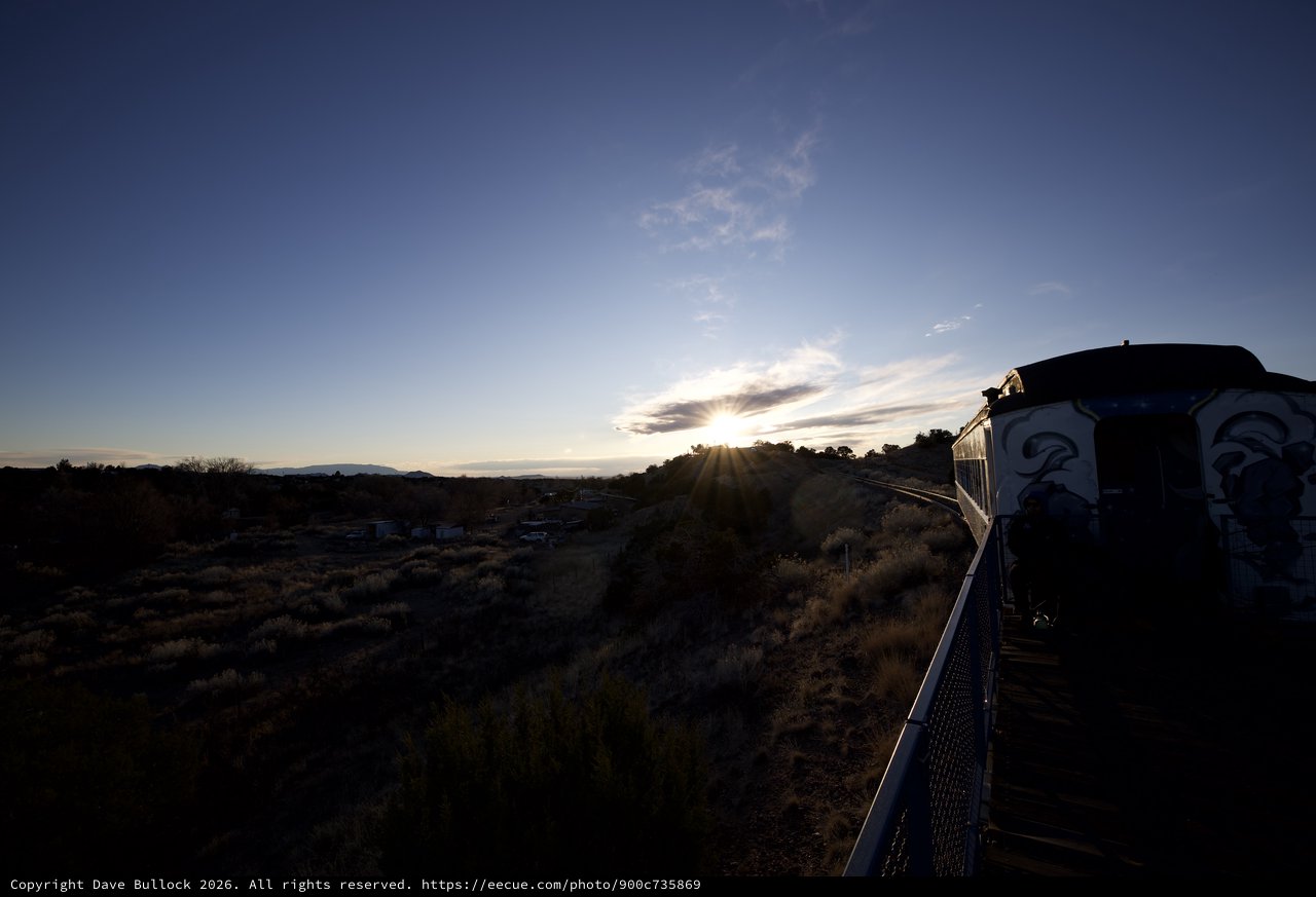 Sunset Over Railroad Tracks with Decorated Building