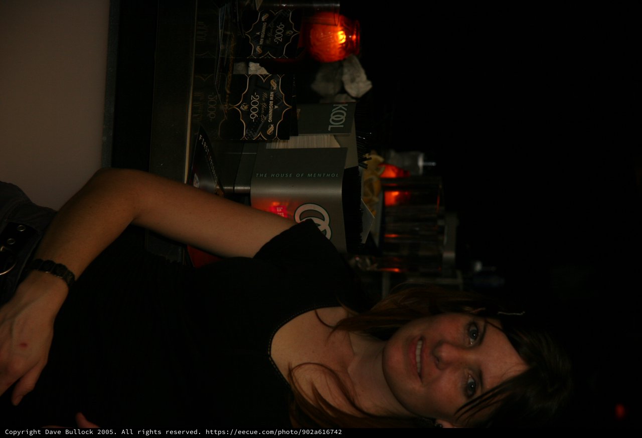 Woman Smiling at New Year's Eve Bar Setup
