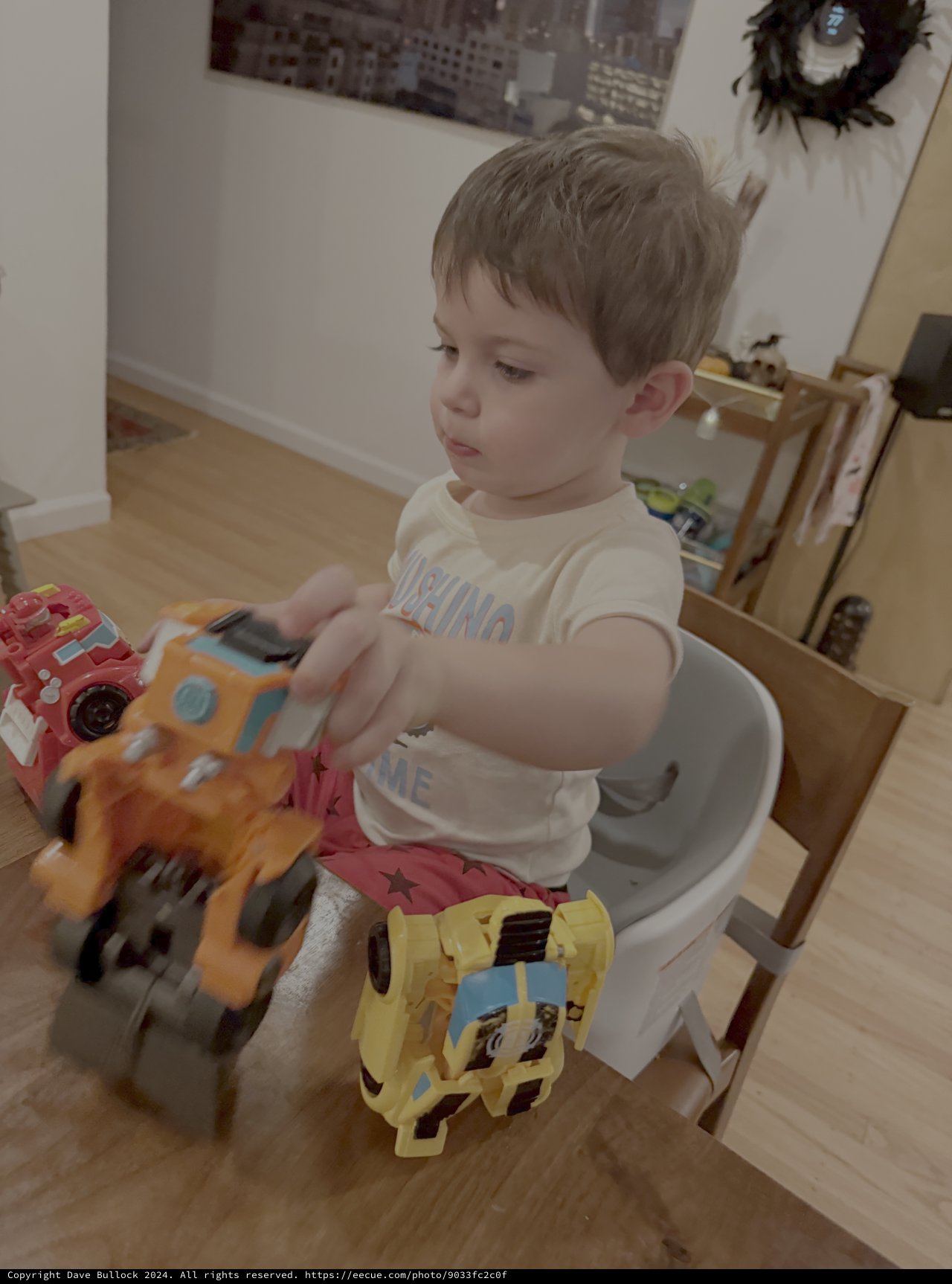 Toddler Playing with Colorful Toy Cars