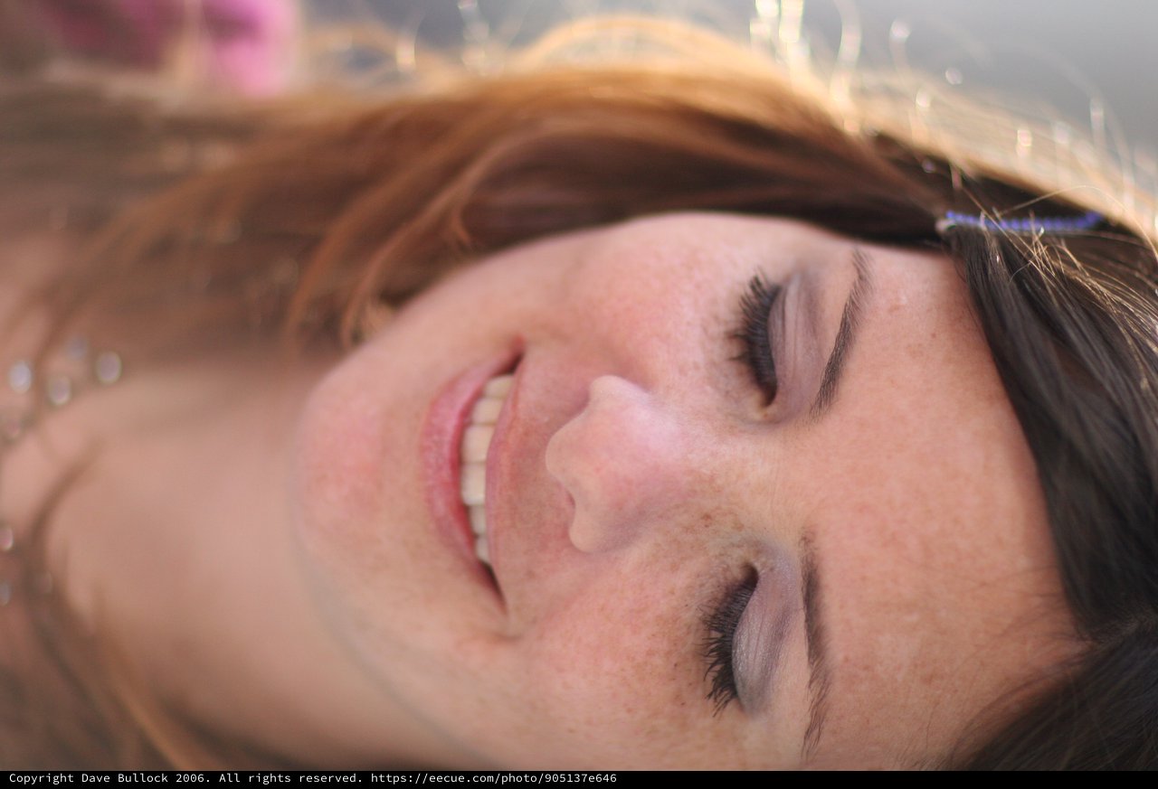Freckled Beauty Smiling Softly in Natural Light