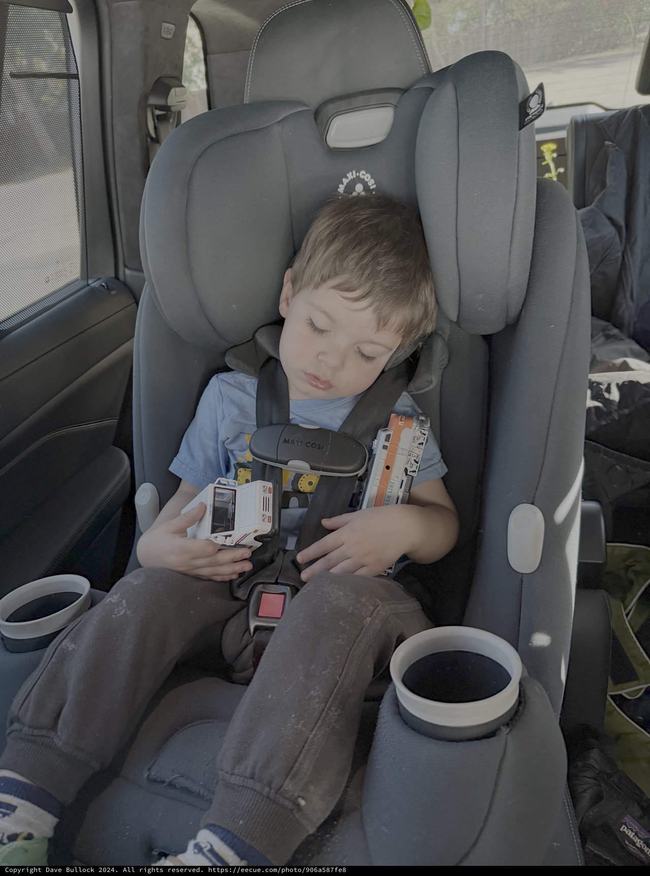 Child Sleeping Peacefully in Car Seat During Travel