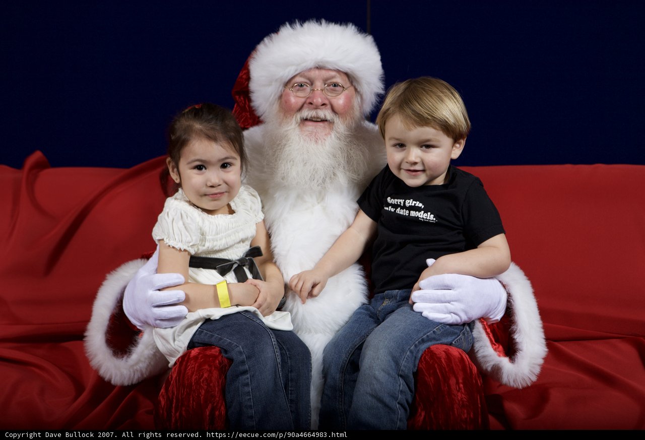 Santa Claus Spends Time with Two Adorable Kids
