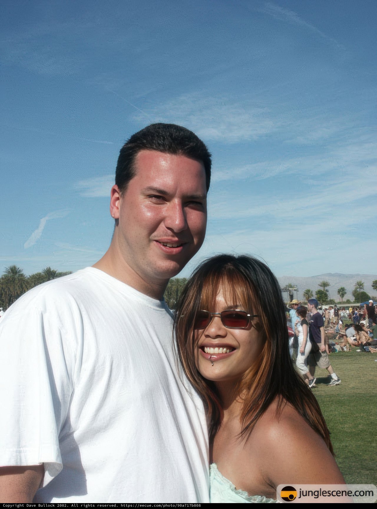 Posed portrait of Rob G and a woman at Coachella