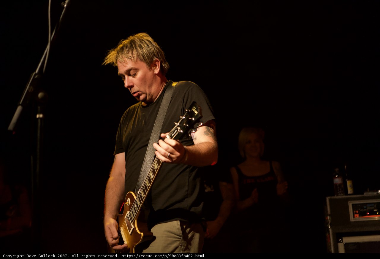 Brian Baker Rocks the Stage with his Electric Guitar at 2007 Bad Religion Glasshouse Concert