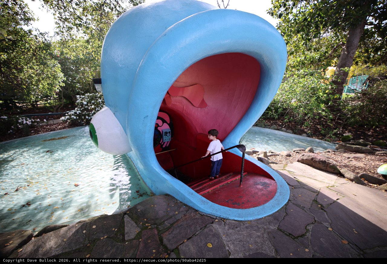 Child Exploring Giant Whale Mouth Playground Sculpture