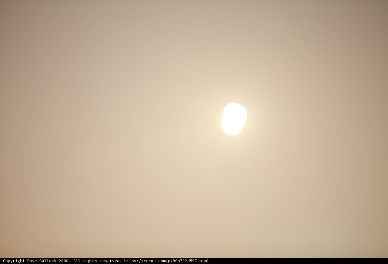 Sun's Illumination Over a Foggy Landscape