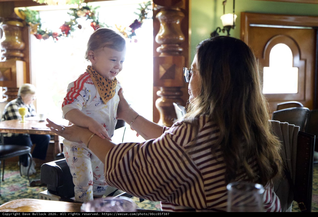Joyful Moment Between Mother and Toddler in Festive Home