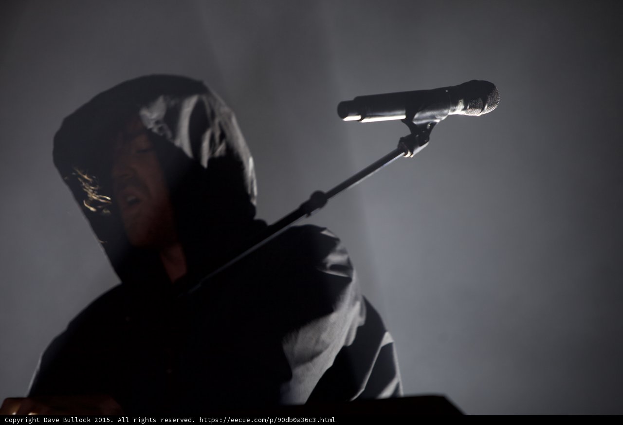 Hooded Performer Looking Down
