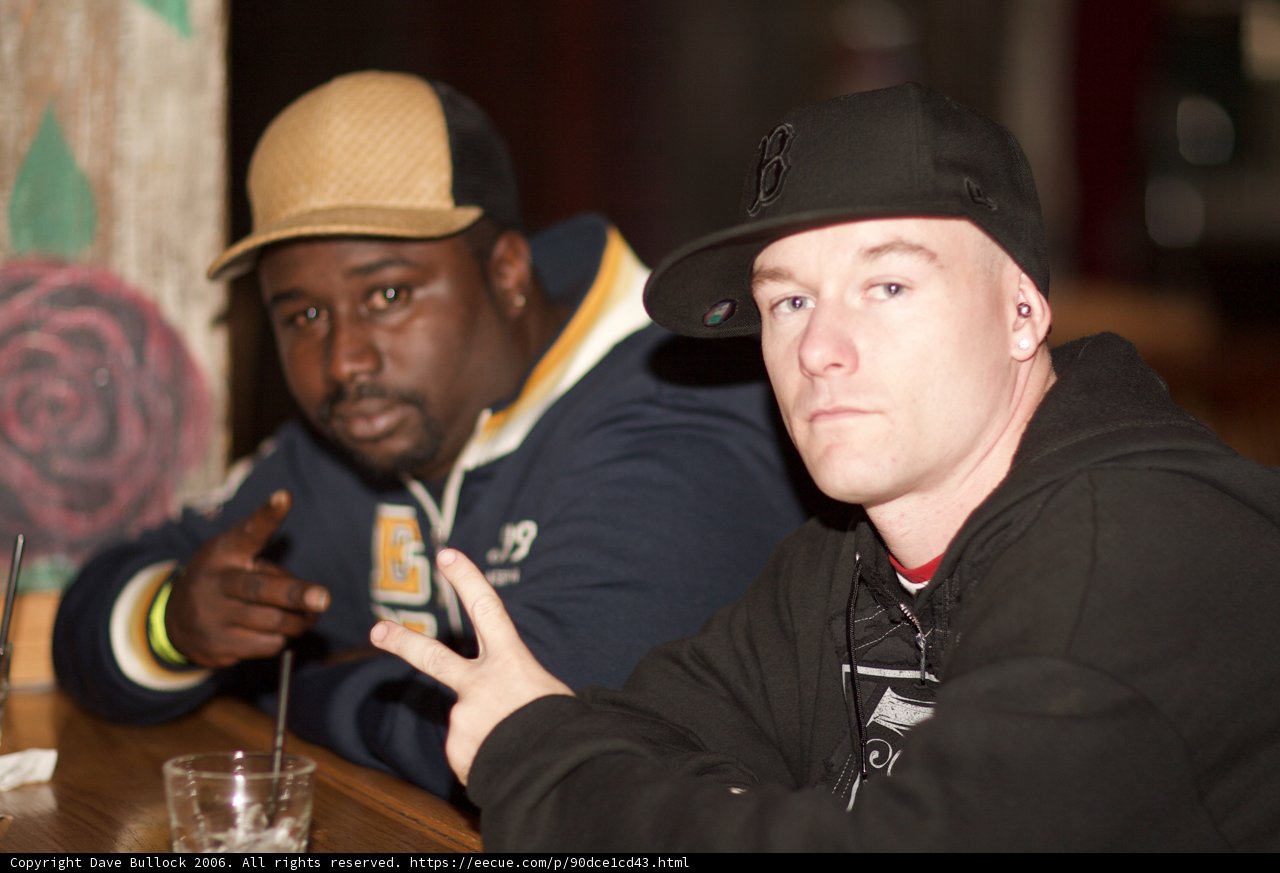 Two Men Enjoying a Cold Beer at a Pub