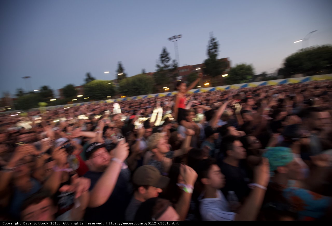 Motion Blur Crowd Woman on Shoulders