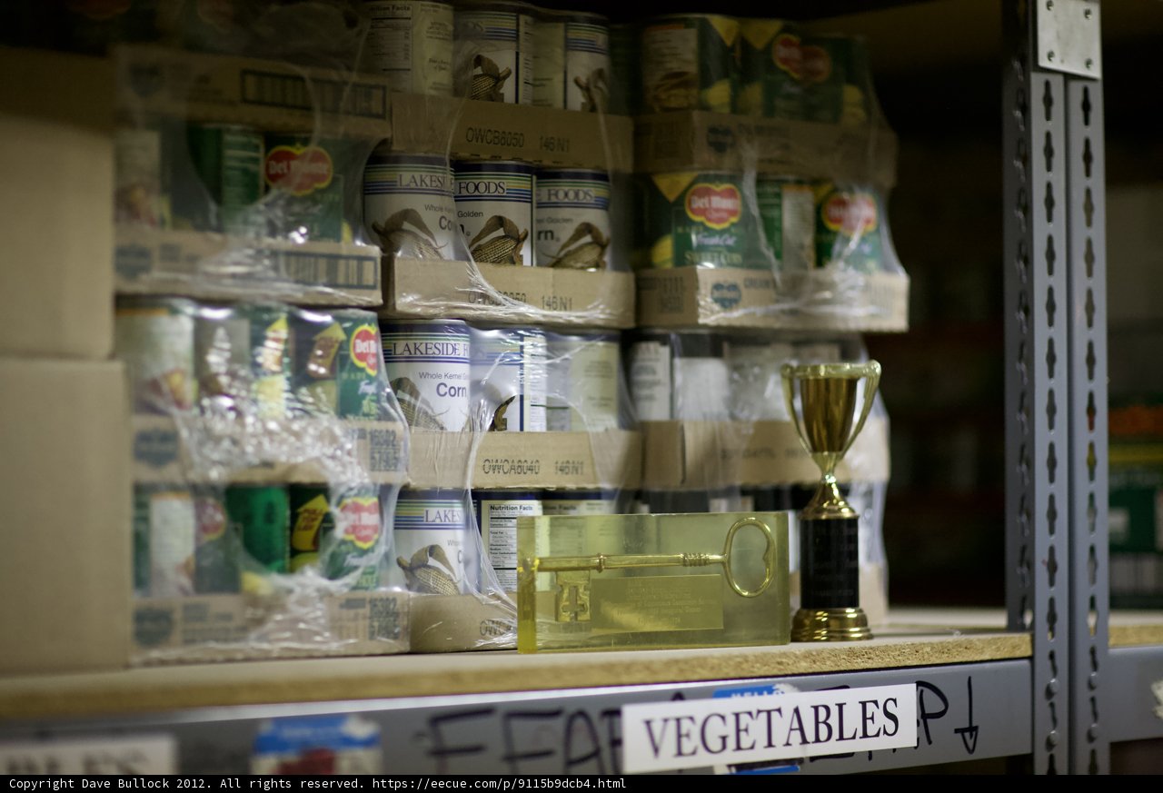 Trophy and Canned Goods on Shelf