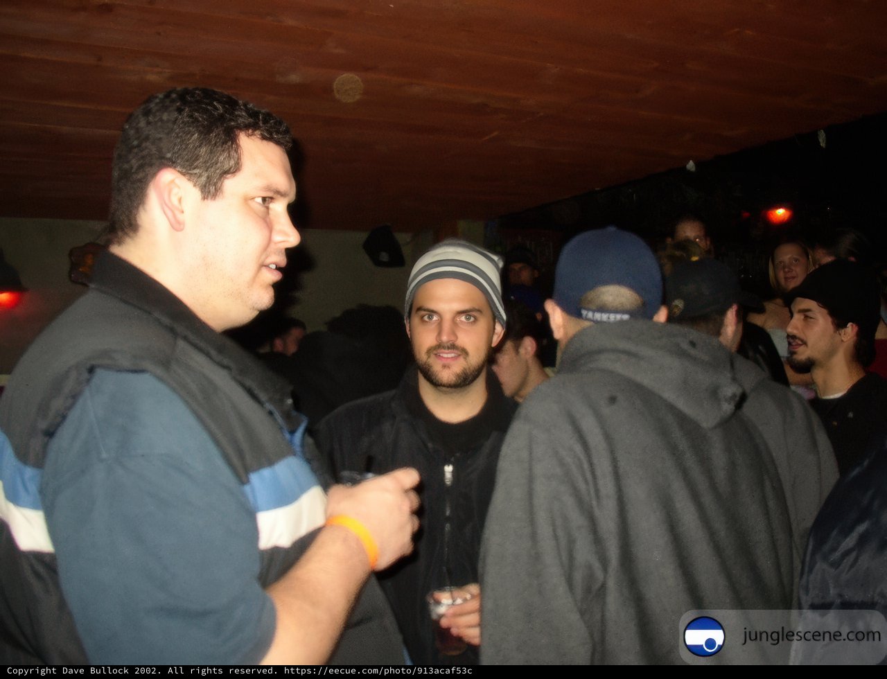 Two Men in Conversation at Night Club
