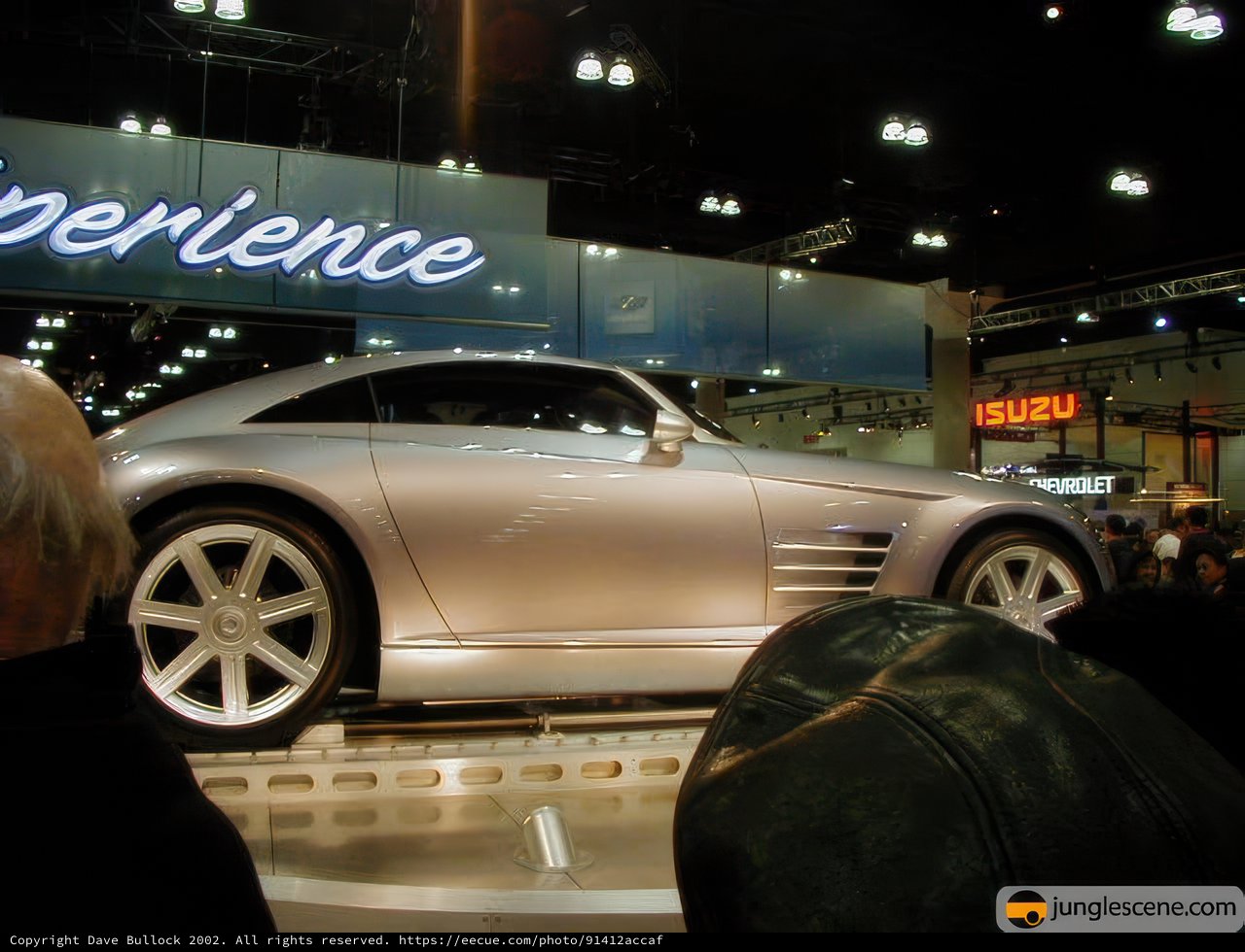 Sleek and Shiny: A Silver Sports Car at the LA Auto Show