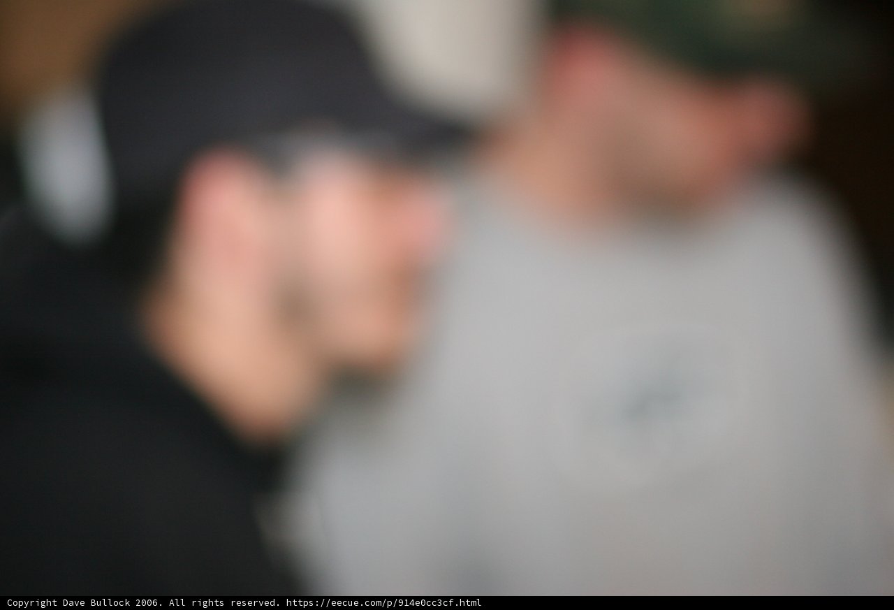 Two Men Sporting Baseball Caps
