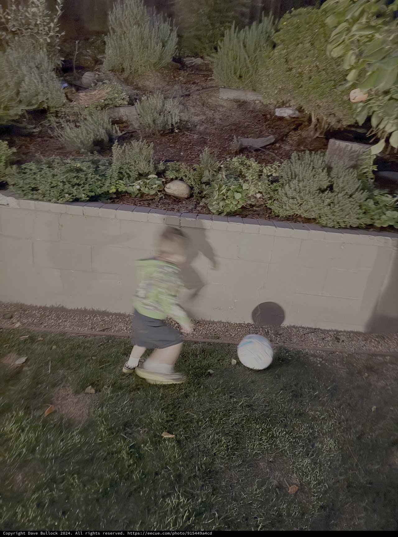 Motion Blur Child Playing on Sidewalk