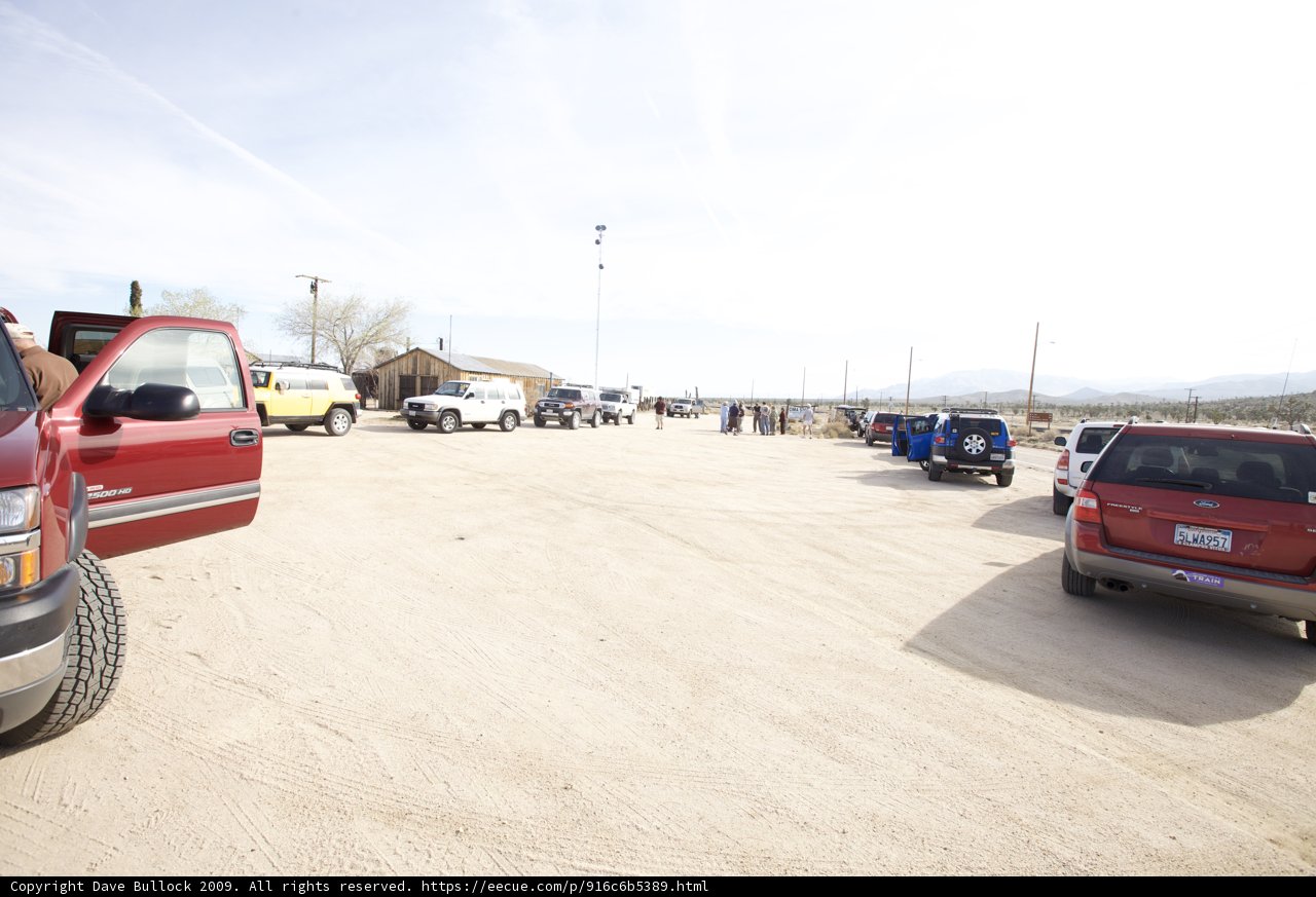Red Truck Parked in Desert Lot