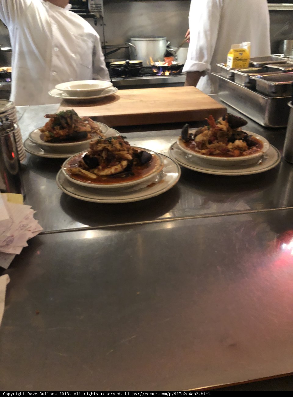 Chefs Preparing a Delicious Meal in a Restaurant Kitchen