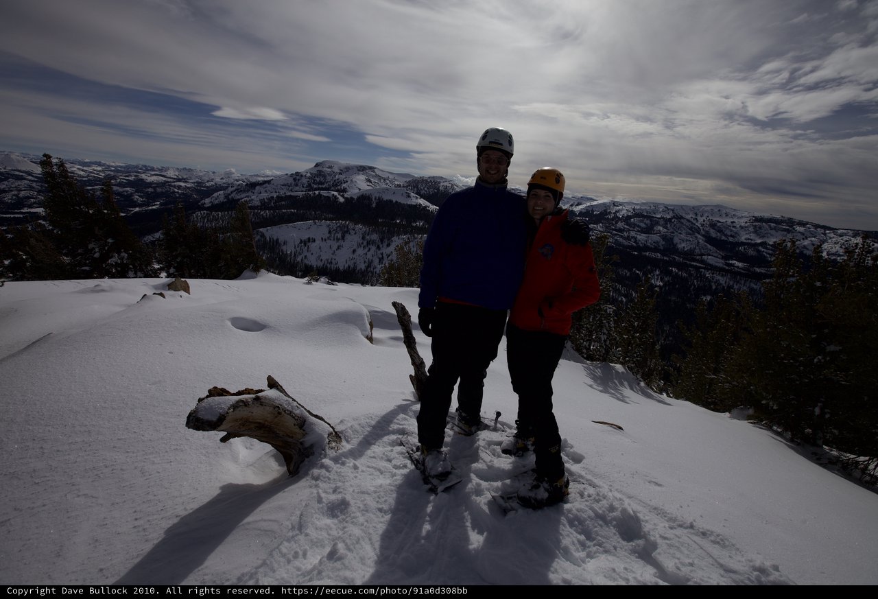 Summit Victory: Couple Atop Snowy Sierra Nevada Peak