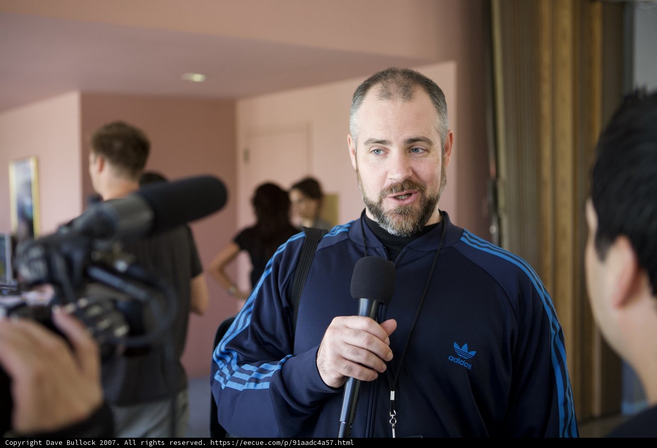 Blue Jacket and Two Microphones