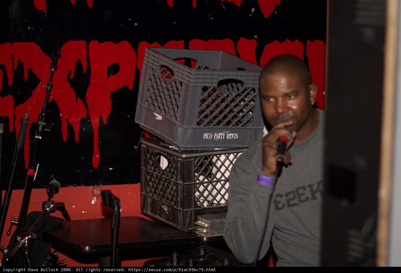 Steve J Holds Microphone in Front of Crate
