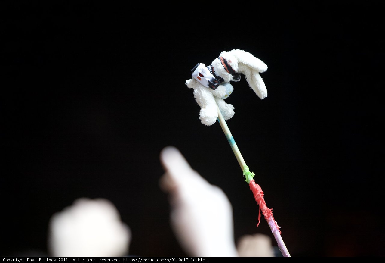 Stuffed animal stick held by a hand