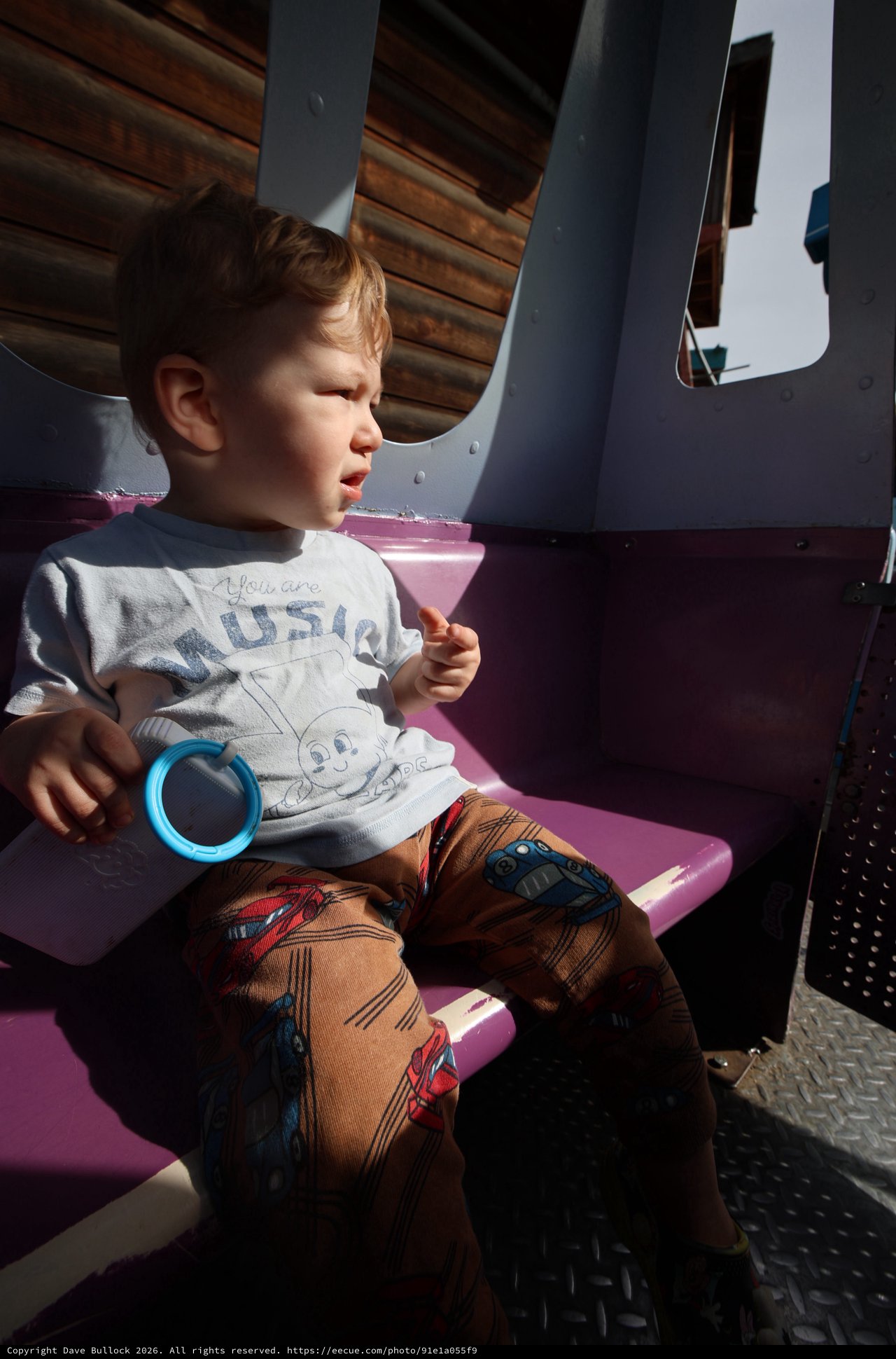 Young Child on Amusement Park Ride at Fantasyland