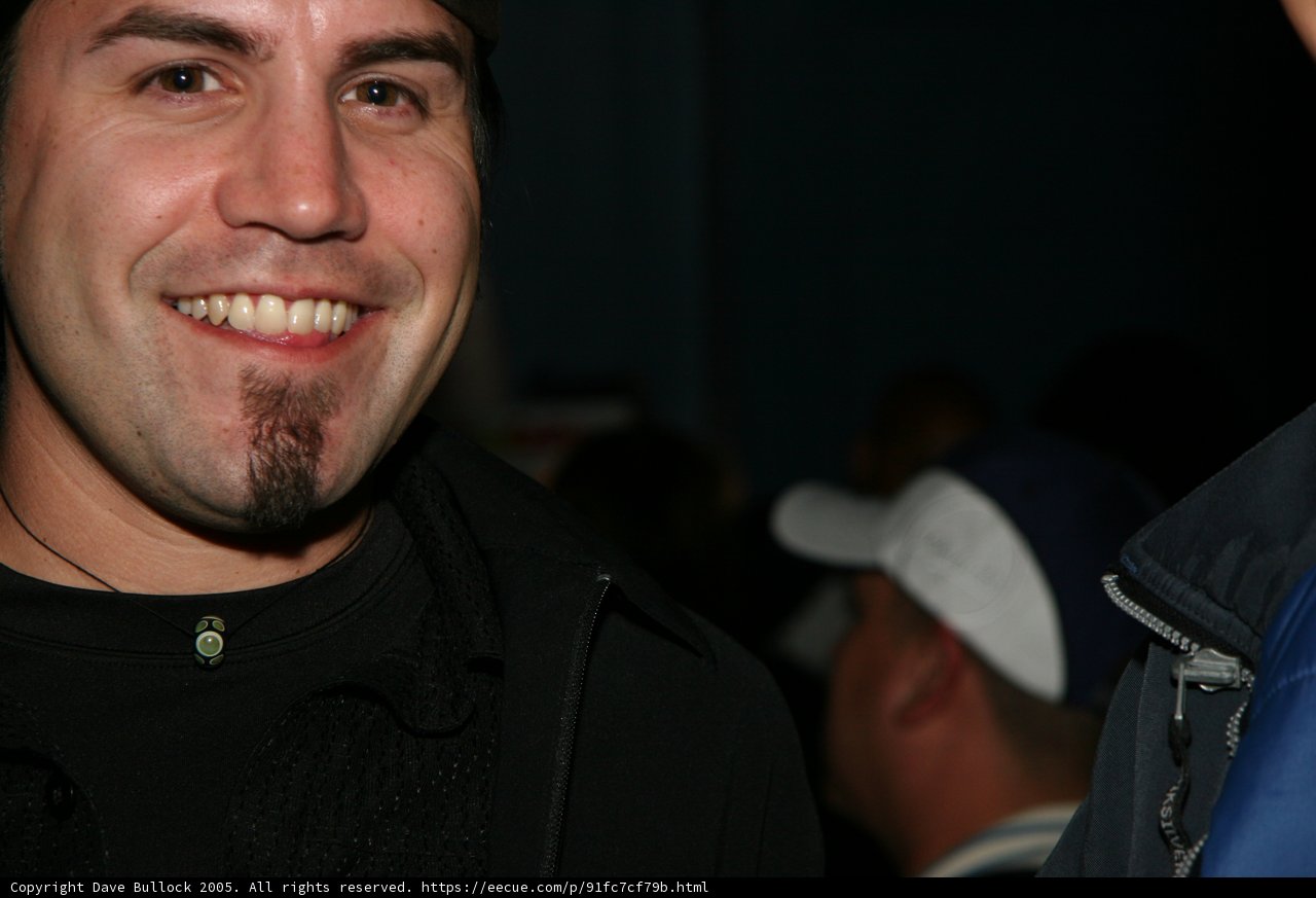 Black Shirted Man with Baseball Cap
