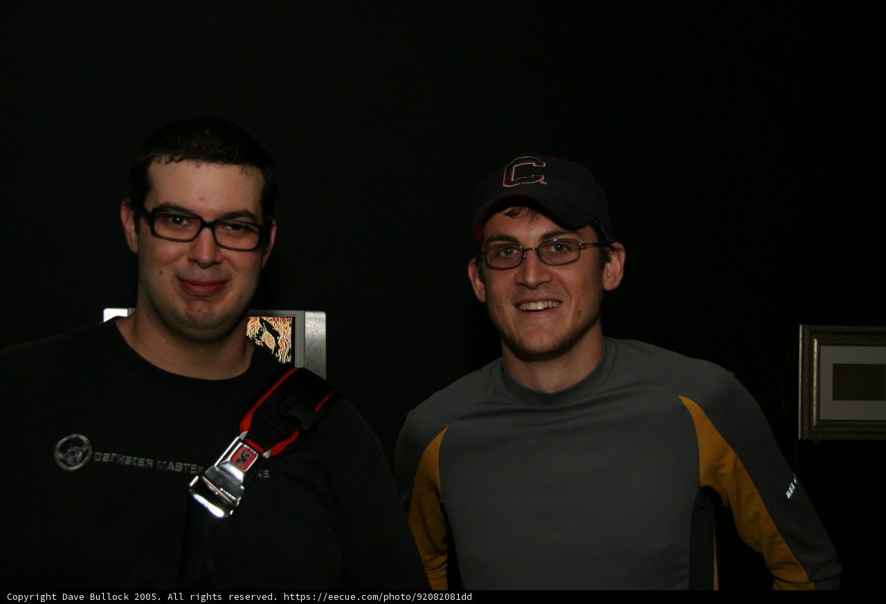Two Men in Glasses Strike a Pose