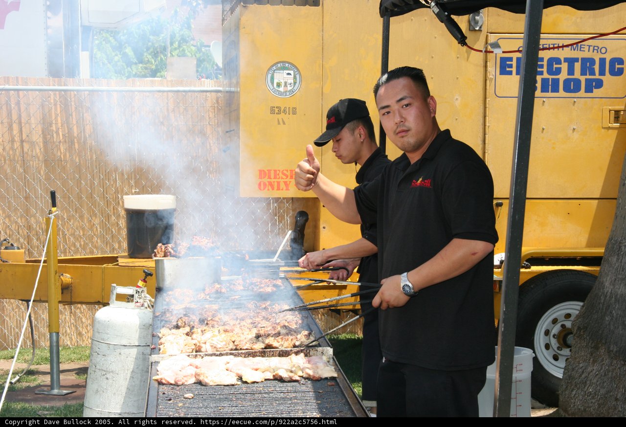 Man Barbecuing with His Wristwatch On