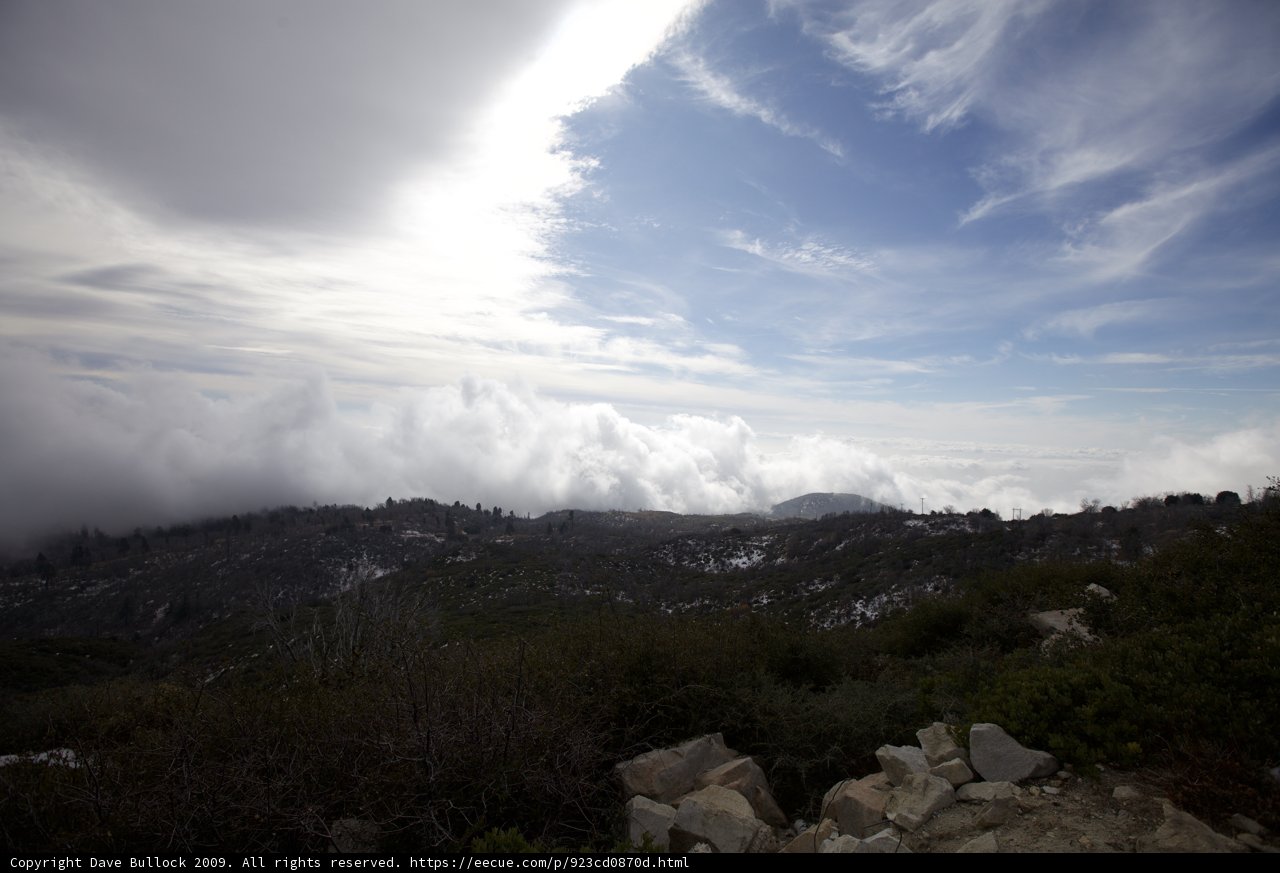 Majestic View of Clouds and Mountains from a Plateau
