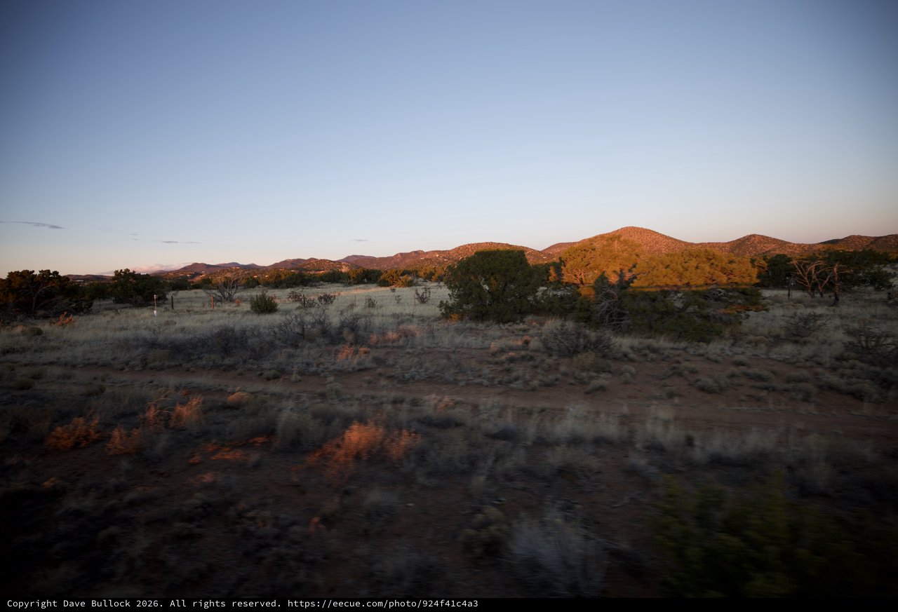 Desert Twilight Over Scrubland Hills and Mountains