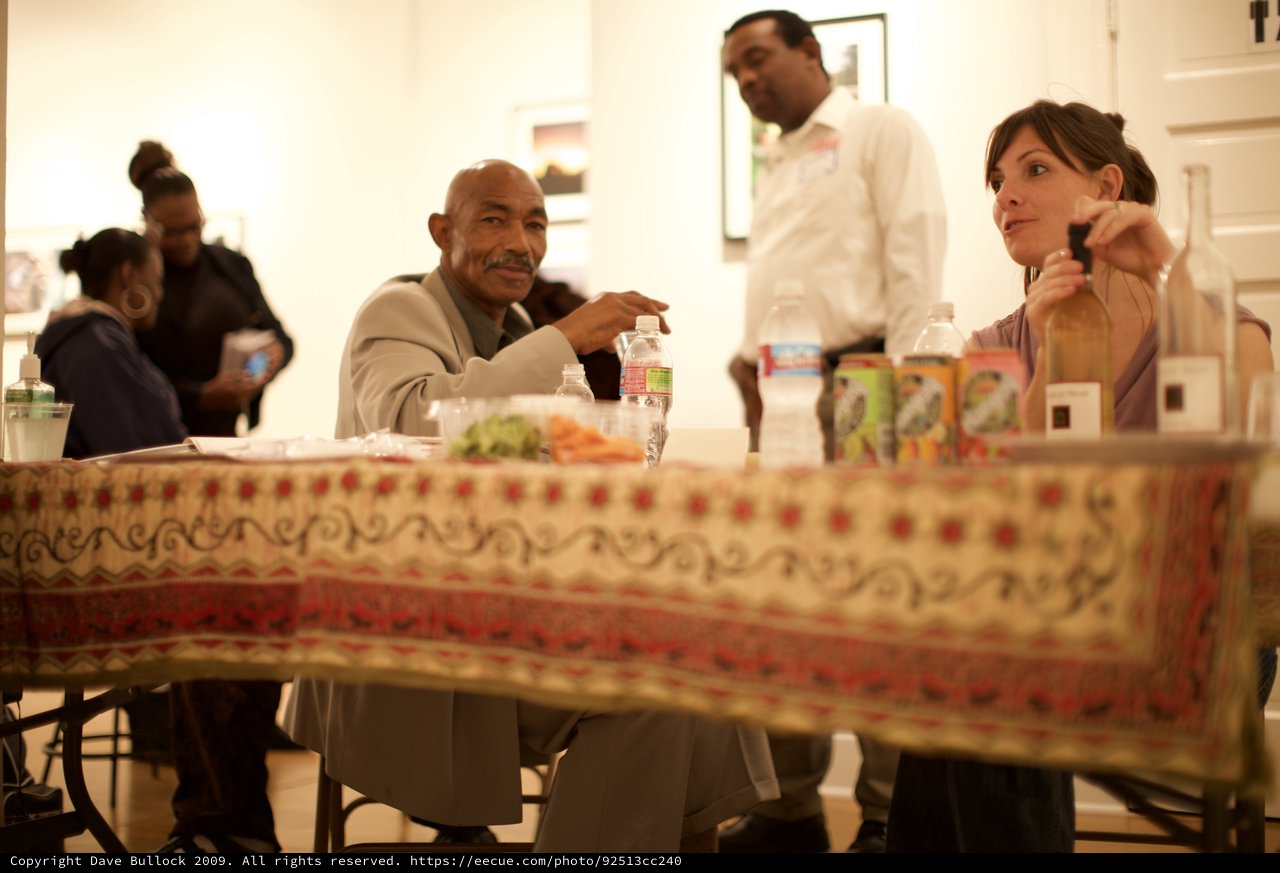 Conversation at a Community Gathering Over Dinner