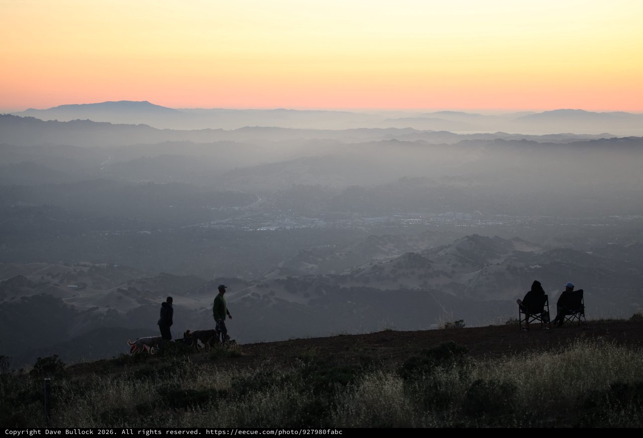 Twilight Silhouettes Over Misty Valley Vista